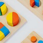 Nursery Playroom - Close-up Shot of Colorful Shapes on the White Table