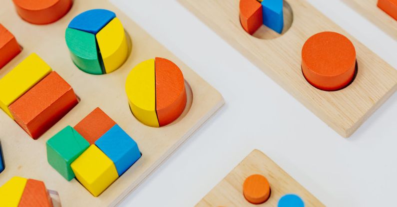 Nursery Playroom - Close-up Shot of Colorful Shapes on the White Table