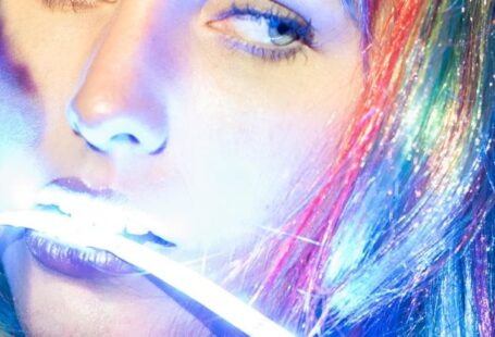 LED Strip Lighting - Woman With Colorful Hair with LED Strip Light in the Mouth